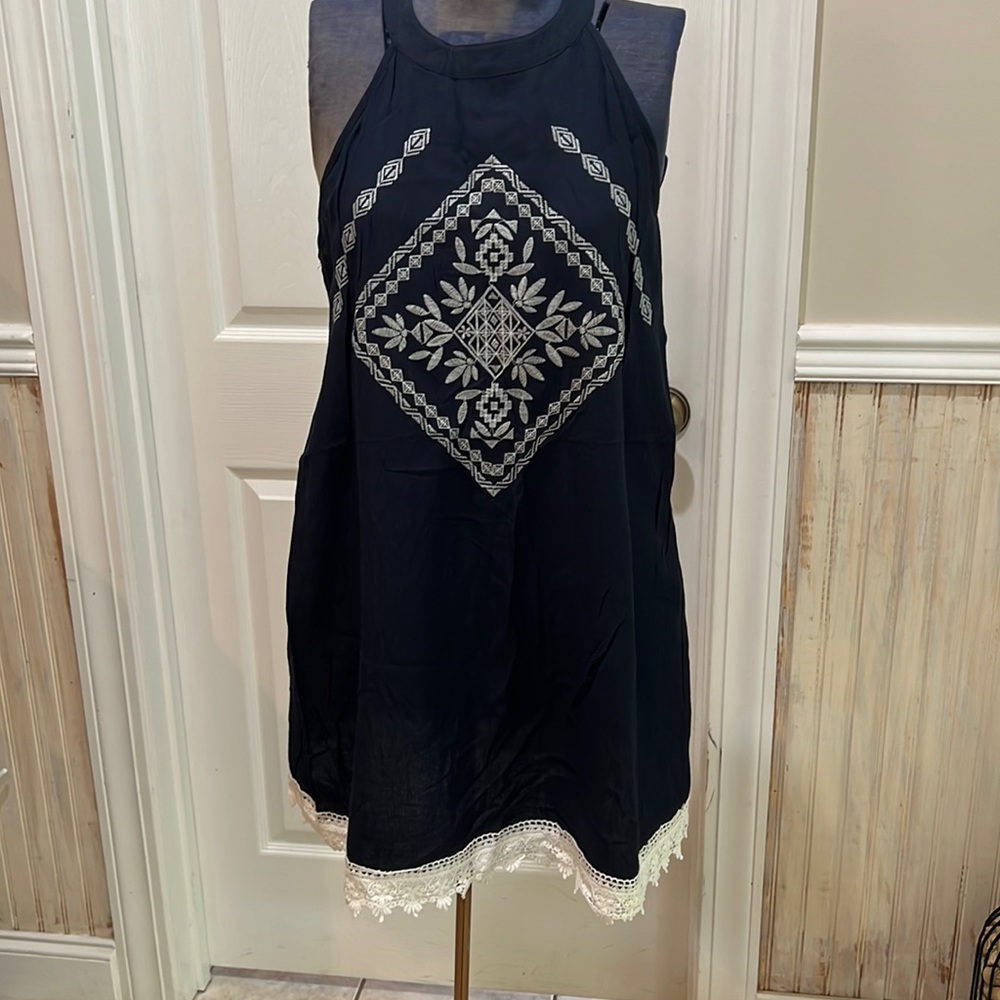 Never worn, navy blue with white embroidered stitching and white crotchet edge.